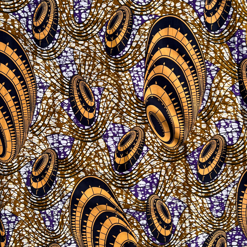 Close-up of authentic Ankara cotton wax print fabric showing detailed pattern clarity, rich color saturation, and durable medium-weight quilting cotton texture.