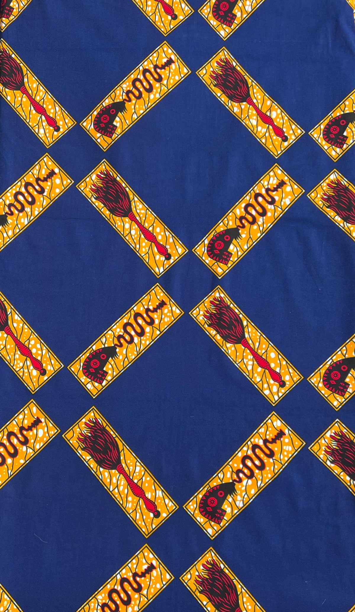 Ankara quilting fabric sewn into vibrant patchwork quilt blocks, highlighting bold African print cotton suitable for modern quilting and statement textile art.