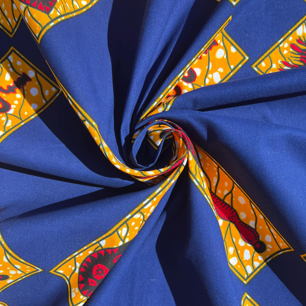 Handmade dress crafted from authentic Ankara cotton wax print fabric, demonstrating vibrant African textile suitable for garments, headwraps, and cultural fashion.